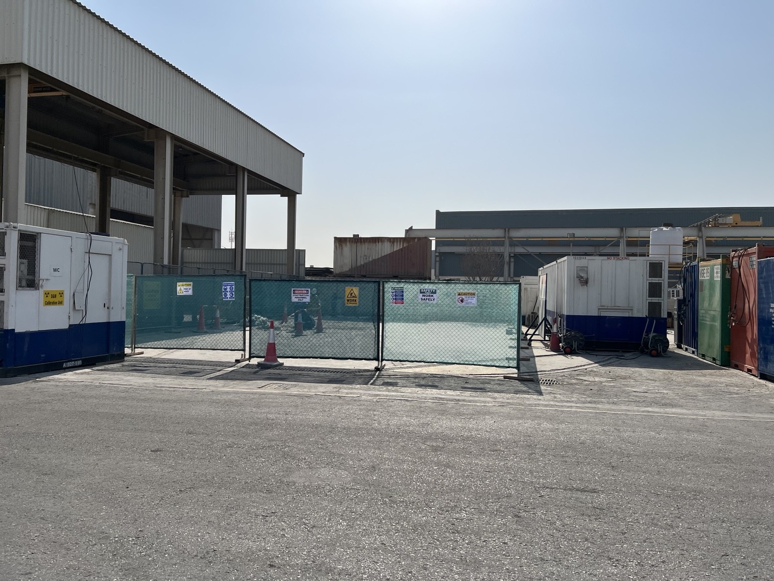 Profiletec infrastructure project site entrance with industrial buildings and safety fencing